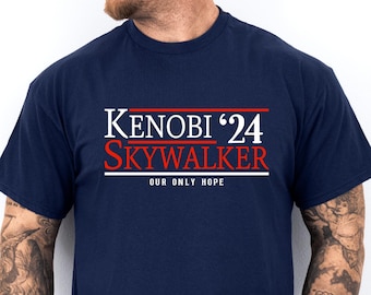 May include: A navy blue t-shirt with white text that reads "KENOBI '24 SKYWALKER OUR ONLY HOPE".