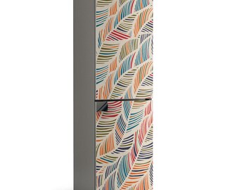 May include: A two-door fridge with a vibrant feather design. The pattern includes curved lines in orange, red, blue, and green on a cream backdrop. The sides of the fridge are a neutral grey colour.
