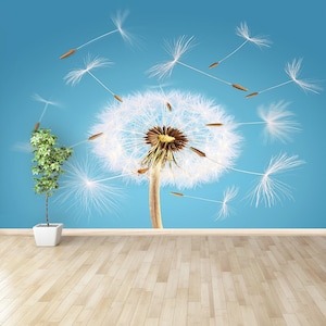 Überblasene Pusteblume als Peel&Stick- oder Vliestapete | Wandbild mit aufgepusteter Pusteblume und Samen, die vom Wind wegfliegen Wandbild abnehmbar