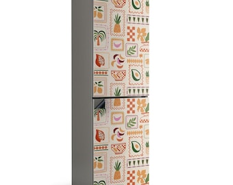 May include: A grey fridge with a patterned wrap displaying fruits, bowls, and floral designs. The wrap includes images of pineapples, bananas, avocados, and palm trees in a repeating pattern. The overall design has a vintage, tropical theme.