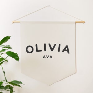 a natural coloured pennant banner that you can customise with a name