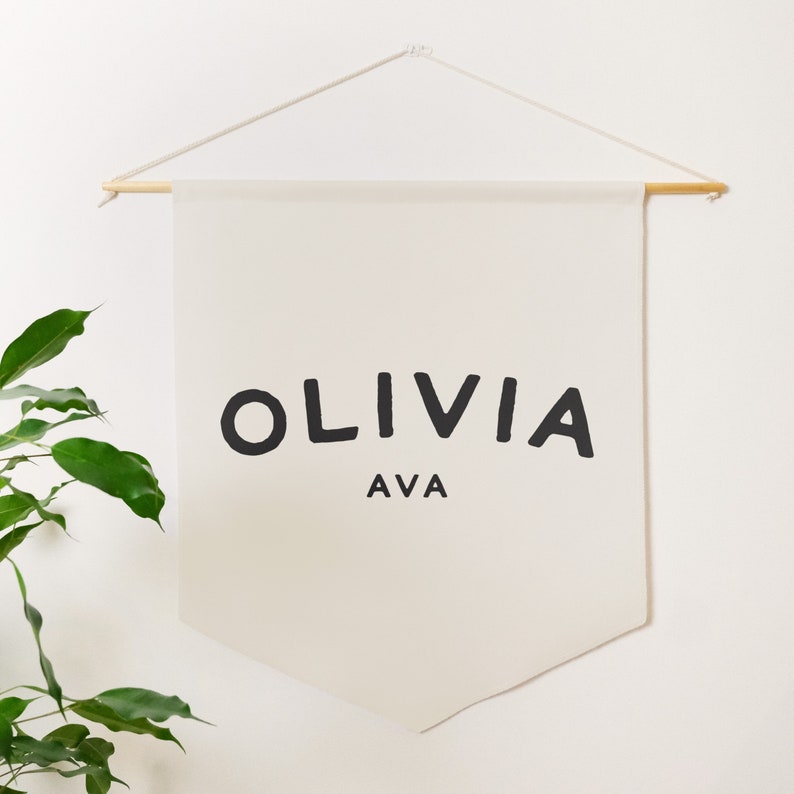 a natural coloured pennant banner that you can customise with a name