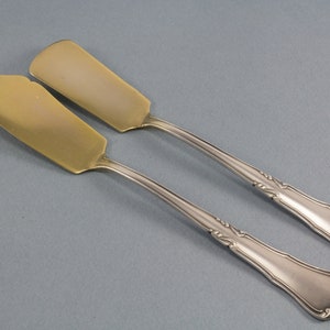 Cheese knife and butter knife by Köberlin, silver and gold plated