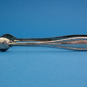 Noble sugar tongs of 800 silver