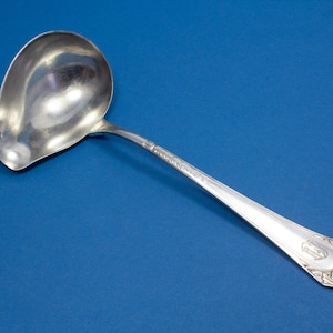Silver plated sauce trowel , engraved