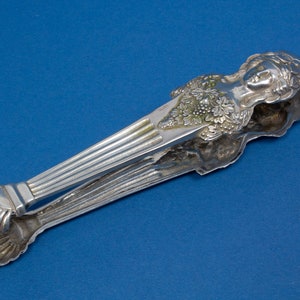 Curious silver tongs, Hanau silver