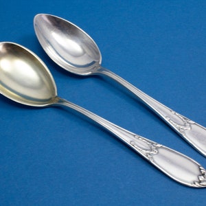 1 antique ice cream spoon with the matching teaspoon in beautiful Art Nouveau style