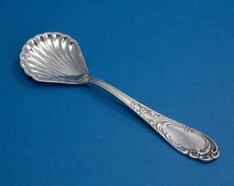 Silver-plated sugar spoon with rococo decorations