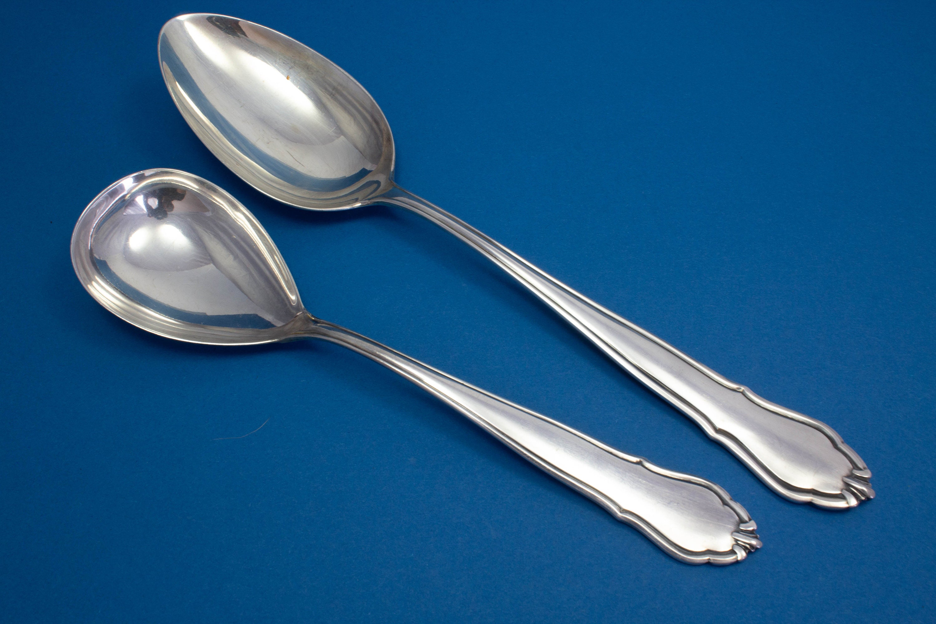 Large vegetable spoon with matching sauce spoon, silver-plated serving spoons