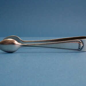 Silver plated sugar tongs with art nouveau pattern