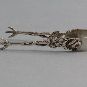 Small rose sugar tongs, 800s, silver