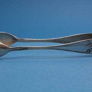 Small pliers in the Art Nouveau style, silvered sugar tongs