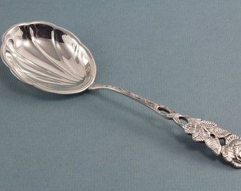 Silver-plated cream spoon with a rose pattern