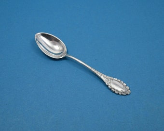 A silver-plated mocha spoon with a rococo pattern