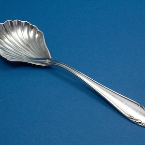 Silver-plated cream spoon with Art Nouveau decorations