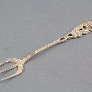 Silver fork with roses, bread fork