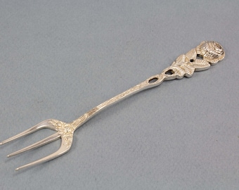 Silver fork with roses, bread fork