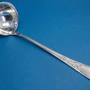 Large silver-plated rococo soup ladle