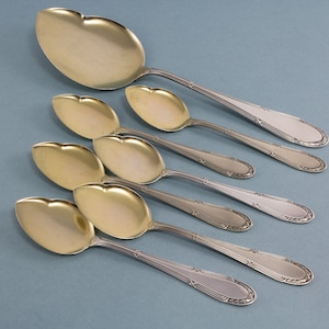 6 rare ice cream spoons and a serving spoon, WMF 200 cross band pattern