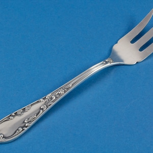 Silver plated bread fork in rococo style