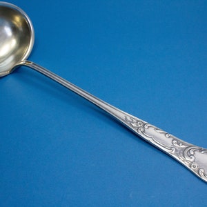 Large silver-plated rococo soup ladle