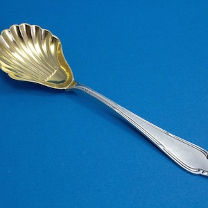 Silver-plated sugar spoon with crossed ribbons by Wellner around 1910