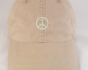 Peace symbol. A fashionable, soft and beautifully embroidered hat or baseball cap.