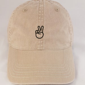 Peace Sign or Victory Hand. A fashionable, soft and beautifully embroidered hat or baseball cap.