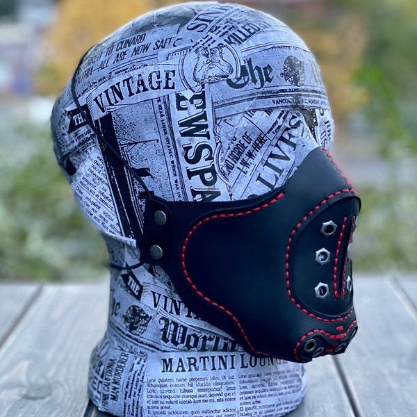 Leather  Mask  in black leather stitched with red thread