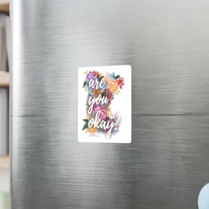 May include: A rustic wooden sign with the text "Welcome to our home" in white lettering. The sign features a distressed finish and a simple, inviting design, perfect for a front porch or entryway.