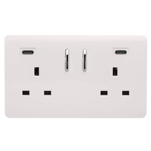 May include: A white double electrical wall socket featuring two standard three-pin outlets, two USB-C charging ports, and two vertical chrome rocker switches positioned in the centre of the rectangular faceplate.