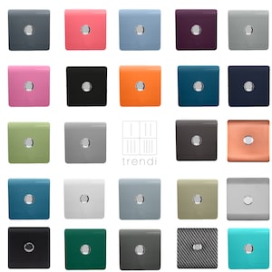 May include: A collection of 24 square wall plates in various colours, including teal, green, pink, orange, grey, and white. Each plate has a single round opening with a silver trim.