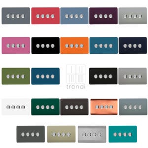 May include: A collection of 20 different coloured wall plates with five silver toggle switches. The plates are arranged in four rows of five. The plates are in various colours, including black, white, grey, green, blue, red, orange, and pink. The text "trendi" is printed in white on a white background in the centre of the image.