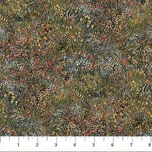 May include: A fabric with a detailed pattern of autumn foliage in shades of green, brown, orange, and yellow. The design includes various leaf shapes and textures, creating a naturalistic, textured appearance. A ruler is at the bottom, showing measurements in inches.