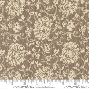 May include: Close-up of fabric with a repeating floral pattern. The fabric features large, cream-colored flowers and vines on a brown background. The design is detailed and intricate, with a vintage or antique aesthetic. The fabric is likely cotton or a similar material.