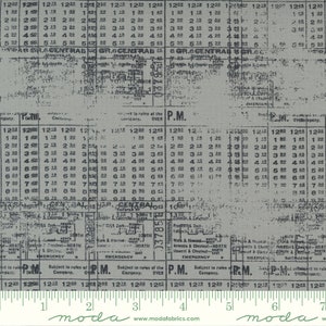May include: A vintage train timetable printed on a gray fabric with a distressed look. The timetable shows departure times for various train lines, including the Grand Central Railroad. The fabric has a ruler printed at the bottom with the words "moda" and "www.modafabrics.com".