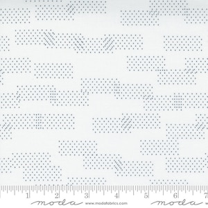 May include: White fabric with a repeating pattern of blue dotted lines and rectangles. The fabric is marked with a ruler in inches and the words "moda" and "www.modafabrics.com".