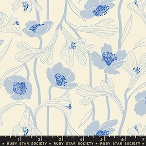 May include: A white fabric with a blue floral pattern. The pattern features stylized flowers with long stems and leaves. The fabric is designed by Ruby Star Society.