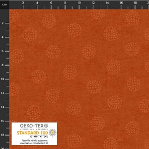 May include: A close-up of a rust-colored fabric with a repeating pattern of small white circles. The fabric has a textured surface and is certified by Oeko-Tex Standard 100, meaning it has been tested for harmful substances.