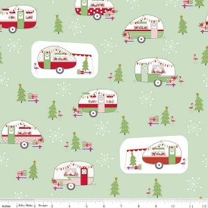 May include: A green fabric with a repeating pattern of vintage camper vans decorated for Christmas. The campers are red, white, and green with pink accents. The fabric also features small green trees, pink flamingos, and white snowflakes.
