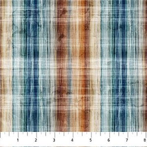 May include: Fabric with a plaid pattern in shades of blue, brown, and beige. The pattern has vertical stripes with a textured, watercolor-like effect. A ruler is at the bottom, showing measurements in inches.