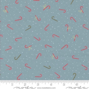 May include: A blue fabric with a repeating pattern of red and green candy canes and small white dots. Some candy canes have small yellow bows. The fabric is suitable for holiday-themed crafts and sewing projects.