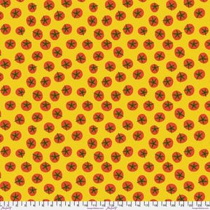 May include: A yellow fabric featuring a repeating pattern of small red tomatoes with green stems. A white measuring tape is visible along the bottom edge, showing measurements in inches from 0 to 24 inches across the width of the textile.