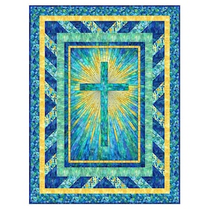 May include: A quilt featuring a stained-glass design with a teal cross at the center, radiating yellow light. The quilt has a blue, teal, and yellow color scheme with geometric patterns and borders.