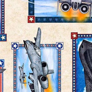 May include: A patriotic fabric featuring a blue, white, and red star pattern with images of military aircraft. The fabric features a fighter jet, a bomber, and a helicopter.