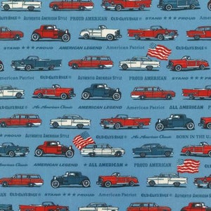 May include: A blue background with a repeating pattern of vintage cars and American flags. The cars are red, white, and blue and have various slogans like "Old Guys Rule", "American Legend", and "Proud American".