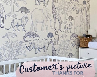 May include: A white crib with a blue and white animal print wallpaper featuring a giraffe, elephant, rhinoceros, and other animals. The text "Customer's picture THANKS FOR supporting me!" is on a pink background.
