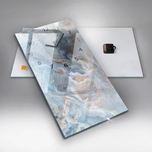 May include: A rectangular glass clock with a blue and white marble design. The clock face has black numbers and hands.
