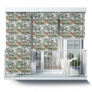 May include: White balcony with a white railing and a white window with a white blind. The balcony has two white roller shades with a pattern of giraffes and zebras in a jungle setting. The shades are pulled down to cover the window.