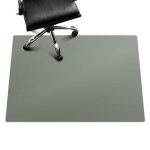 May include: A sage green office chair mat designed to protect floors from rolling chairs.